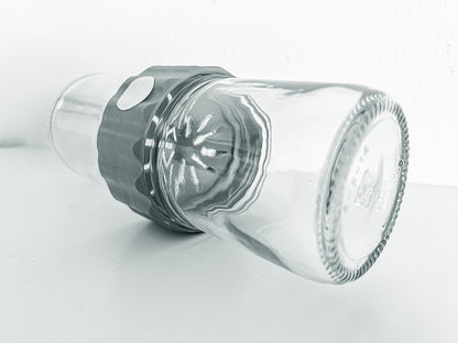 Side  view image of the glass BioCoupler set laying on a flat surface.