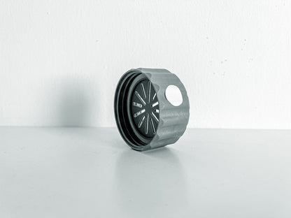 Image of a singular BioCoupler on its side taken from an angle.