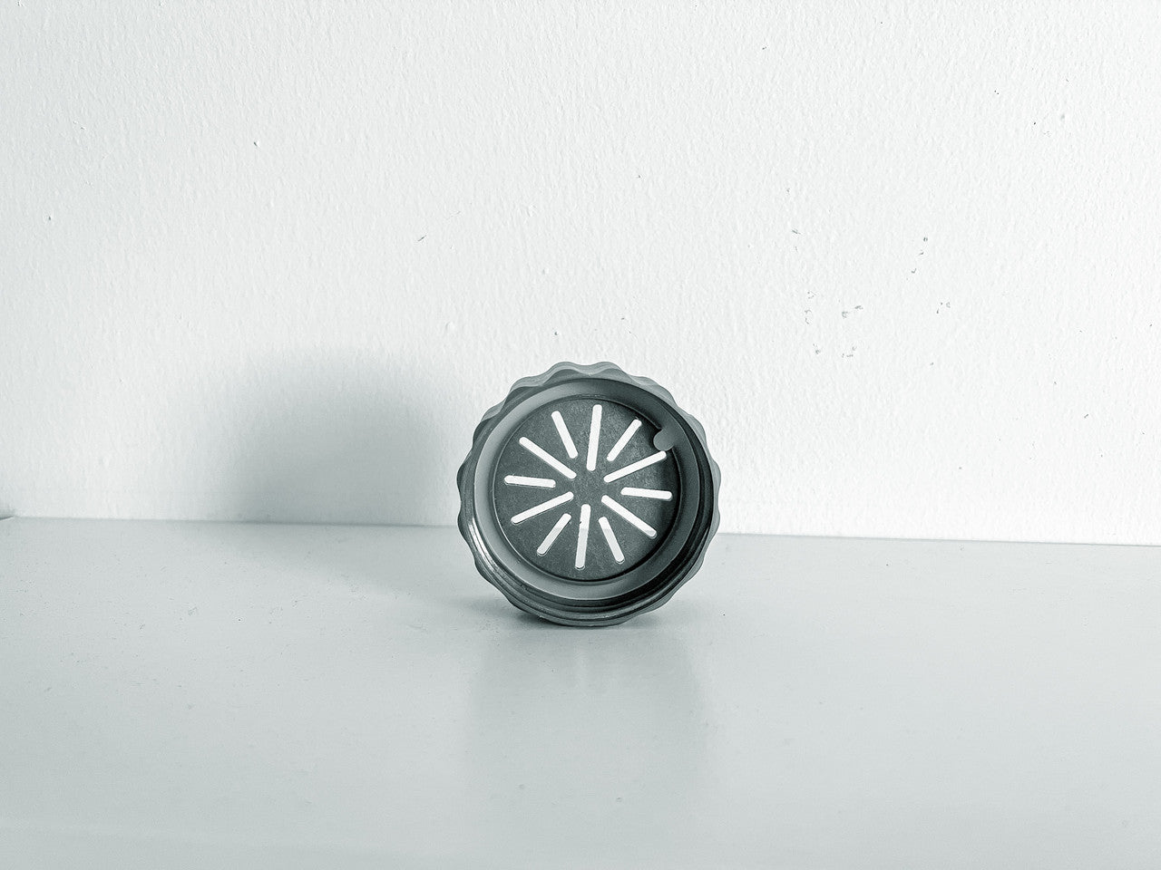 Image of a singular BioCoupler on its side.